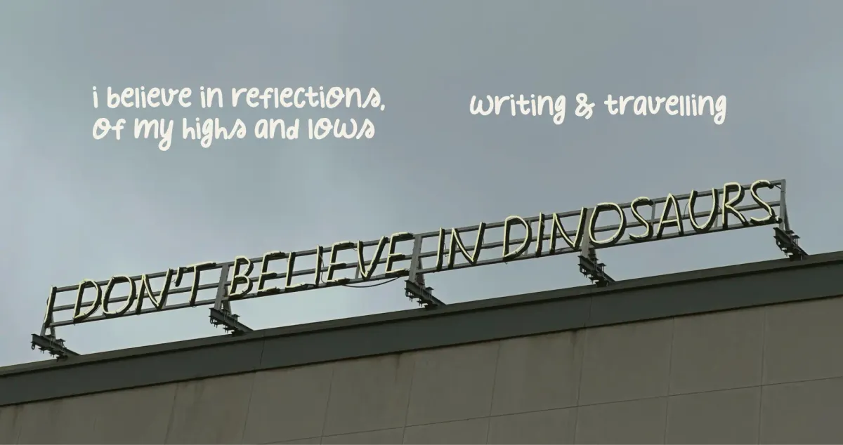 A neon sight on the rooftop that says, "I don't believe in dinosaurs."