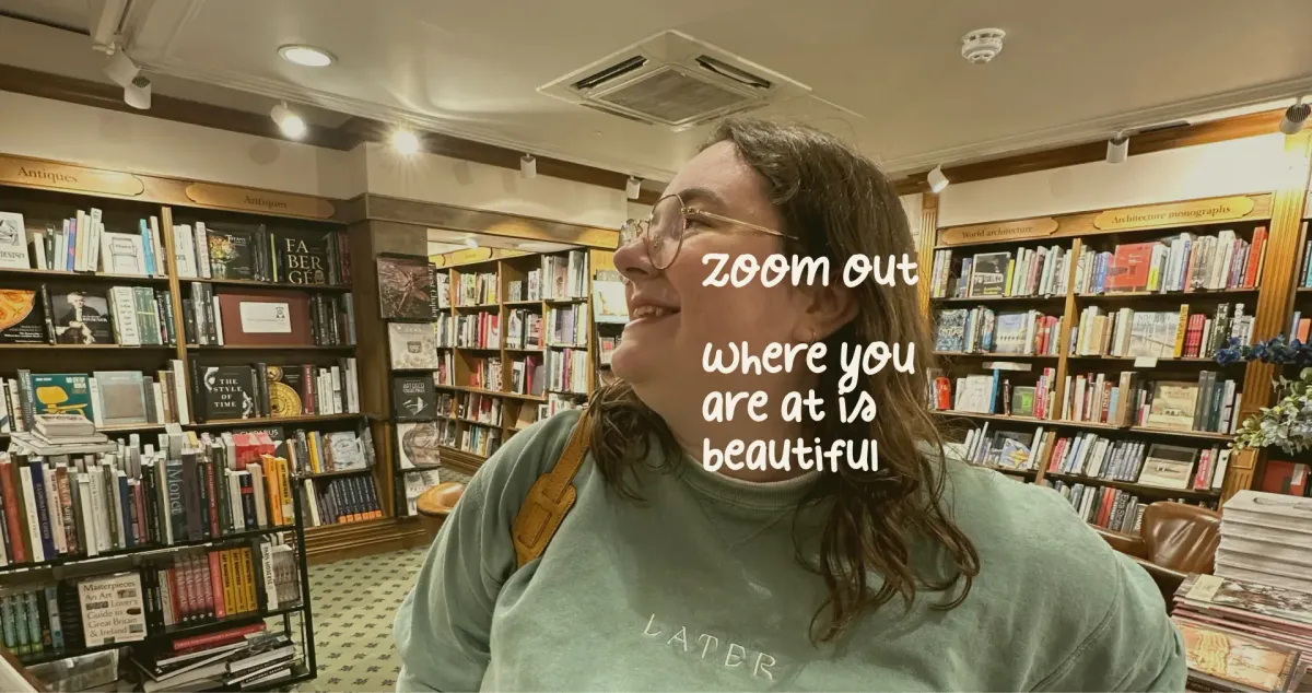 Mariia looks around in the bookshop.