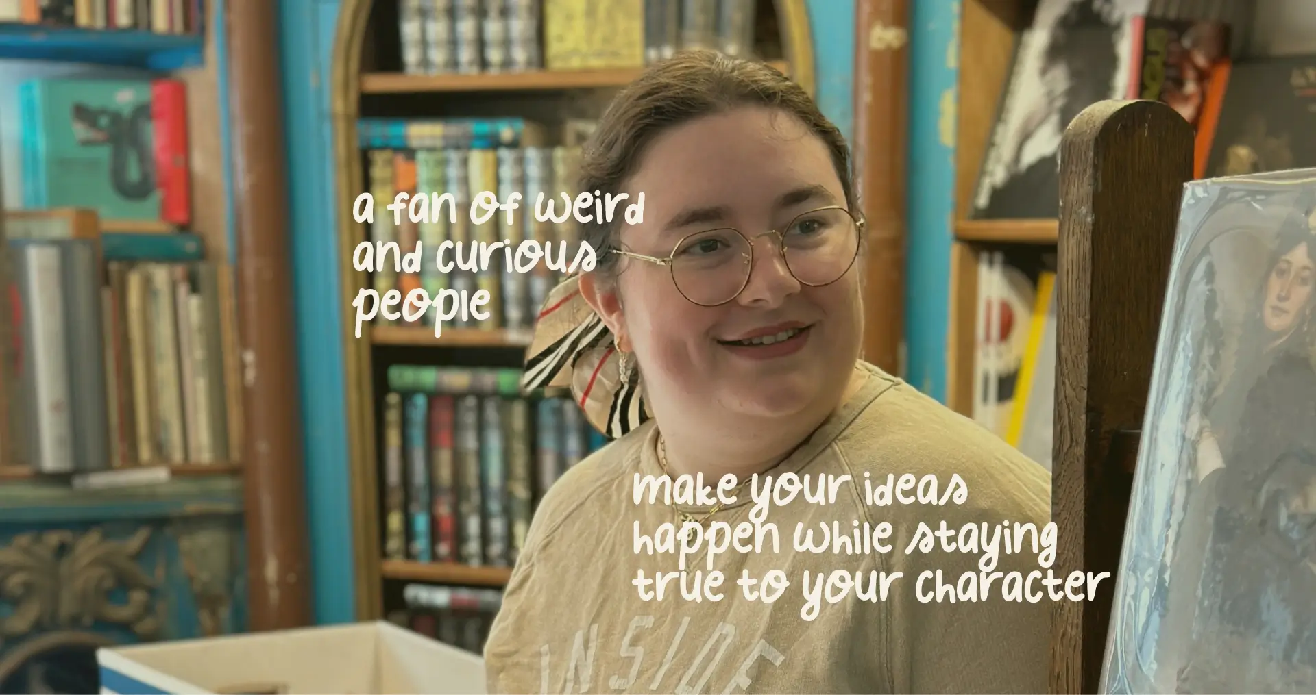 Mariia is in the bookshop: Shelves of the books are in the background while she looks at something off-camera.